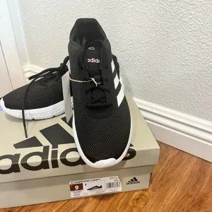 Adidas Black and White Athletic Sneakers with Signature Stripes