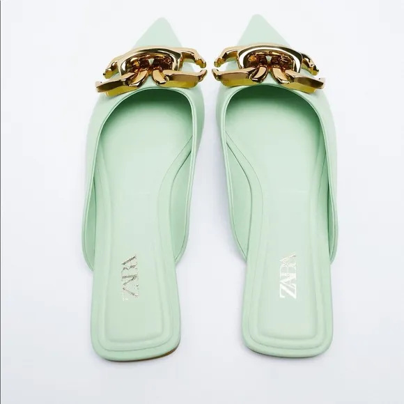 FLAT MULES WITH BUCKLE DETAIL
