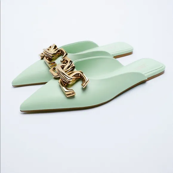FLAT MULES WITH BUCKLE DETAIL