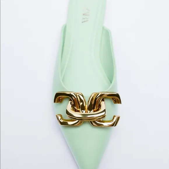 FLAT MULES WITH BUCKLE DETAIL
