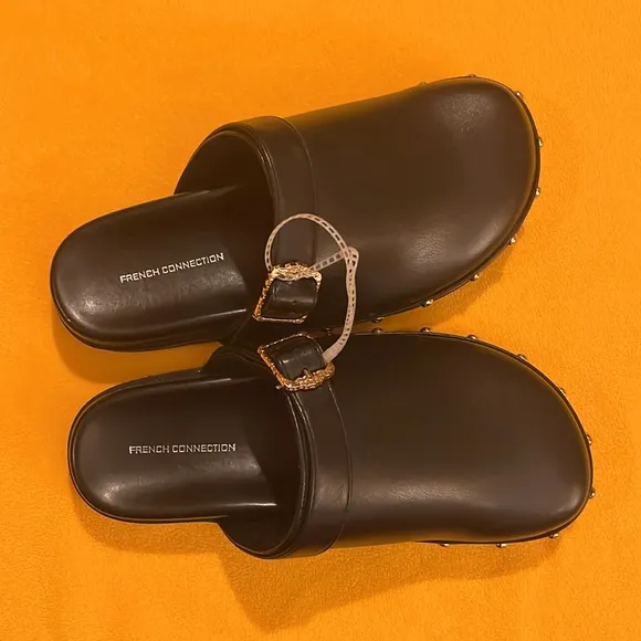 French Connection Chello Buckle Clogs. Black with gold accents. Size 8. NWT