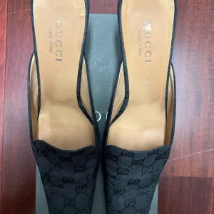 Gucci Black Mules with GG Monogram Design