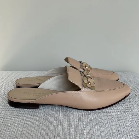Kate Spade “Carilee” leather mules with flower detail