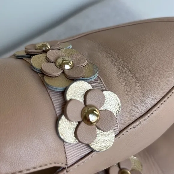 Kate Spade “Carilee” leather mules with flower detail
