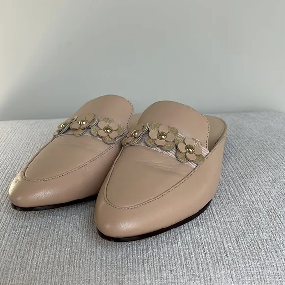 Kate Spade “Carilee” leather mules with flower detail