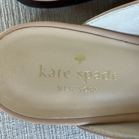 Kate Spade “Carilee” leather mules with flower detail