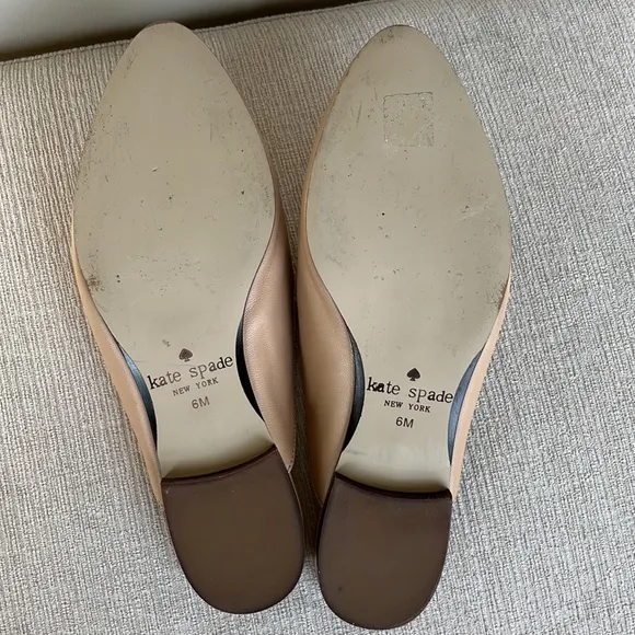 Kate Spade “Carilee” leather mules with flower detail