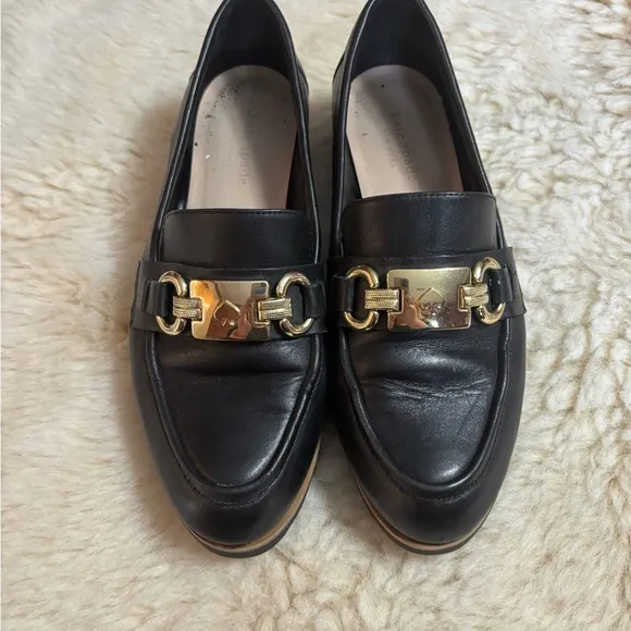 Kate Spade Kolby Black and Gold Loafers with Elegant Metal Accent