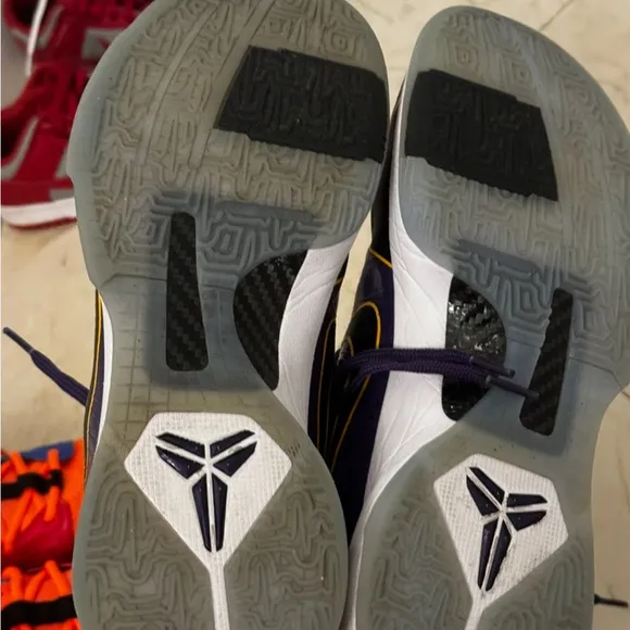 KOBE PURPLE Nike Black and Purple Athletic Shoes with Gold Accents