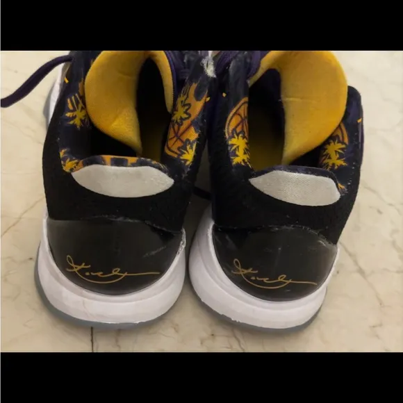 KOBE PURPLE Nike Black and Purple Athletic Shoes with Gold Accents