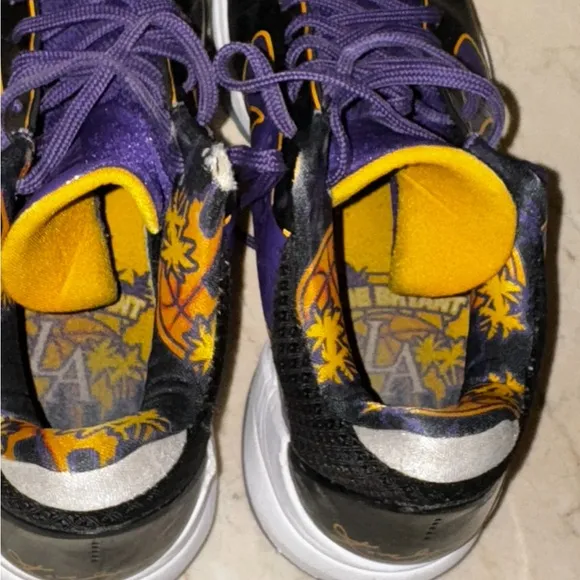KOBE PURPLE Nike Black and Purple Athletic Shoes with Gold Accents
