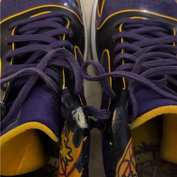 KOBE PURPLE Nike Black and Purple Athletic Shoes with Gold Accents