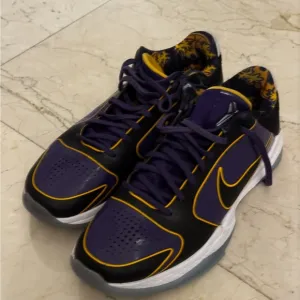 KOBE PURPLE Nike Black and Purple Athletic Shoes with Gold Accents
