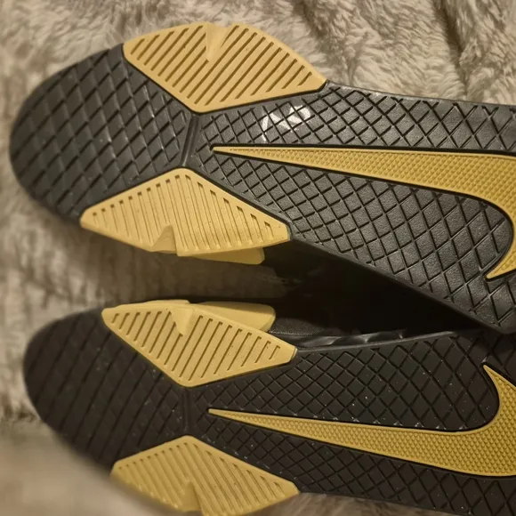 Nike Black and Gold Athletic Shoes with Textured Upper