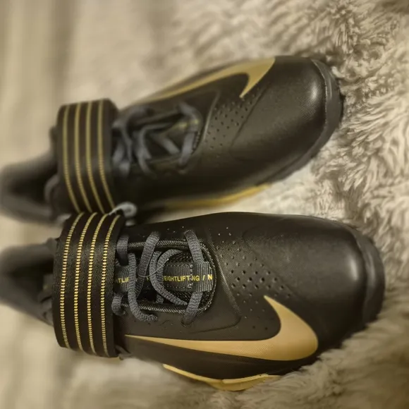 Nike Black and Gold Athletic Shoes with Textured Upper