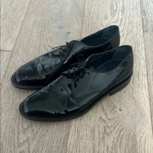 Salvatore Ferragamo Black Patent Leather Oxfords