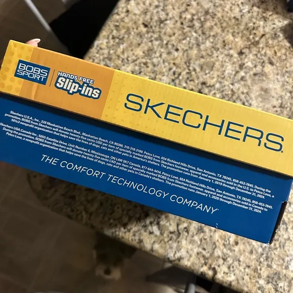 SKECHERS Bobs Sport Slip Ins in black and leopard heel accent