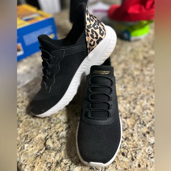 SKECHERS Bobs Sport Slip Ins in black and leopard heel accent