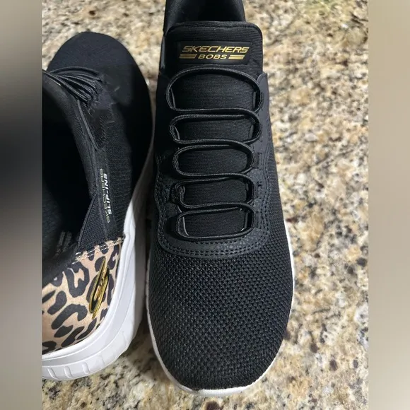SKECHERS Bobs Sport Slip Ins in black and leopard heel accent