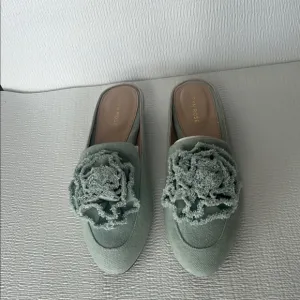 Taryn Rose Green Mules with Floral Embellishments